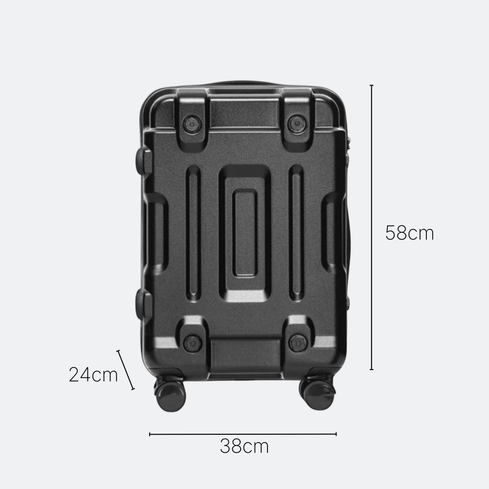 AïtaVia black hard-shell carry-on suitcase with reinforced corners and textured front panel. Dimensions 58x38x24cm.