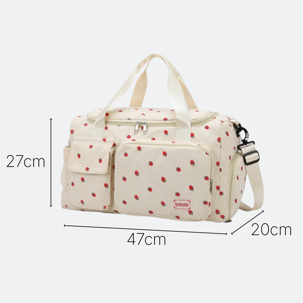 AïtaVia cream corduroy duffel bag with a red strawberry print, featuring dual handles and a detachable shoulder strap.