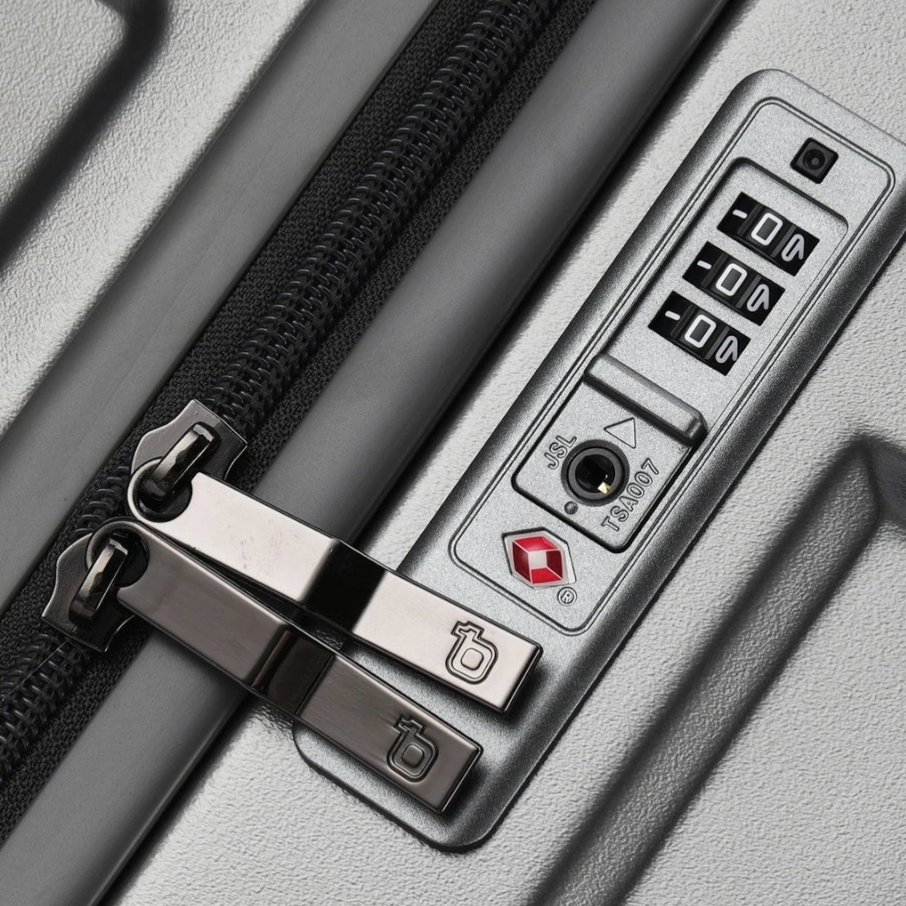 AïtaVia silver suitcase with TSA lock and wide handle luggage zippers.