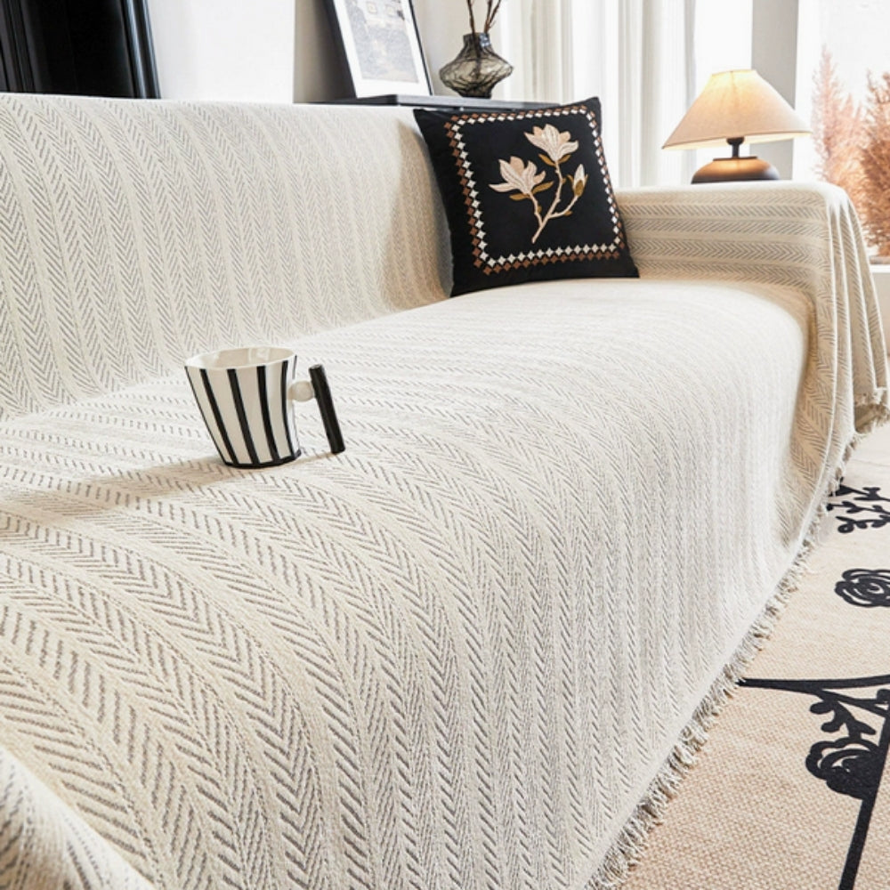 Housse de canapé en chenille à chevrons et franges à pompons