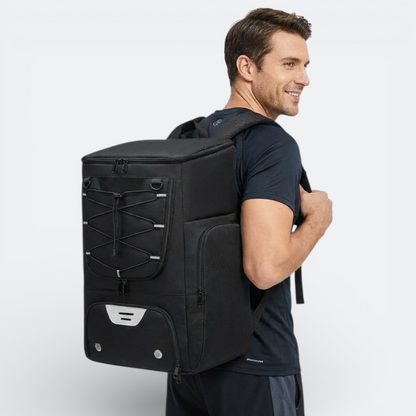 AïtaVia black basketball backpack with bungee cord front and multiple zippered compartments, worn by a man.