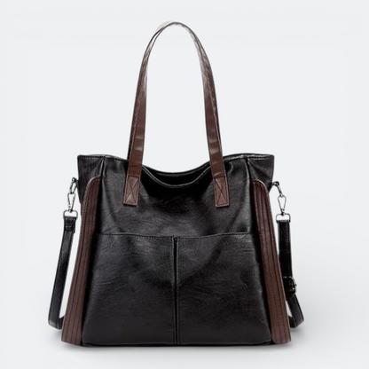 AïtaVia black and brown soft leather tote bag with two front pockets and adjustable shoulder strap.