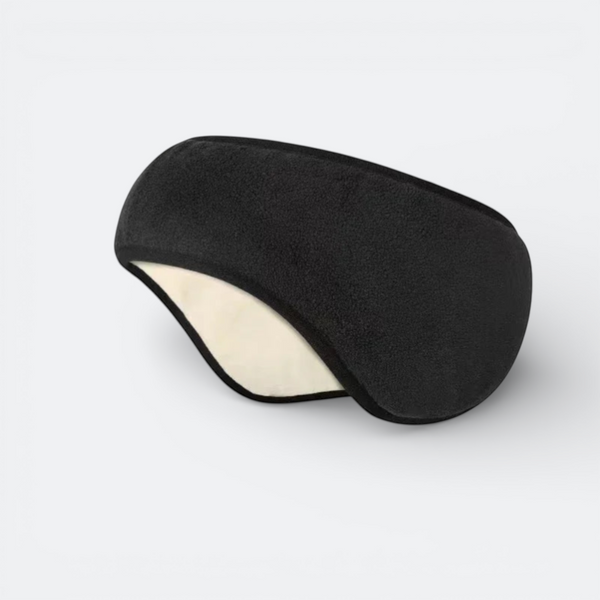 AïtaVia black fleece sleep mask with cream lining for noise and light blocking during travel.