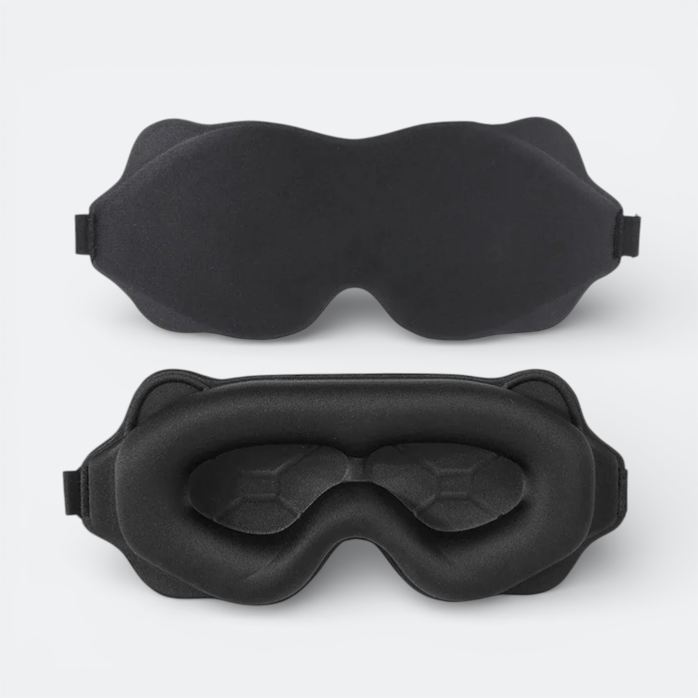 AïtaVia black padded sleep mask with contoured eye cups for total darkness and comfort during travel.