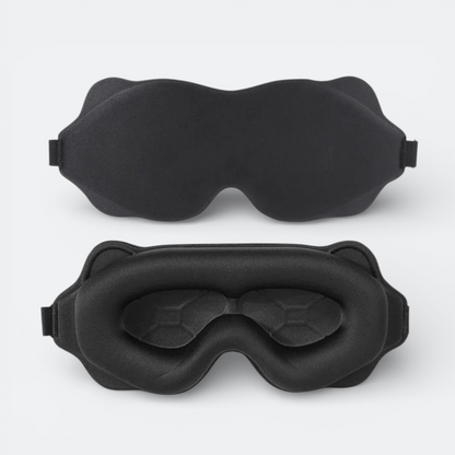 AïtaVia black padded sleep mask with contoured eye cups for total darkness and comfort during travel.