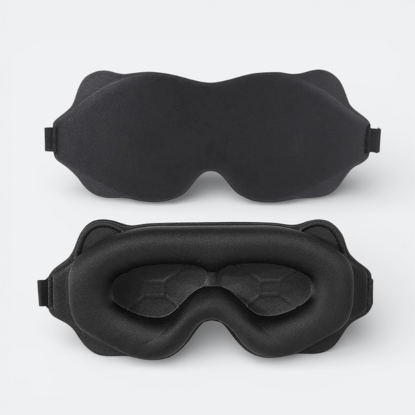 AïtaVia black padded sleep mask with contoured eye cups for total darkness and comfort during travel.