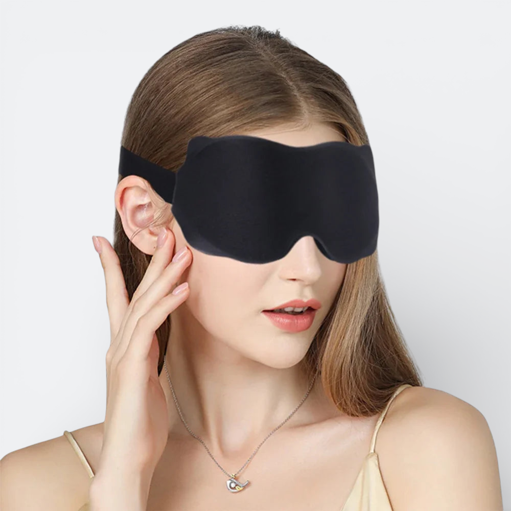 AïtaVia black padded sleep mask with adjustable strap for comfortable travel and blocking light.