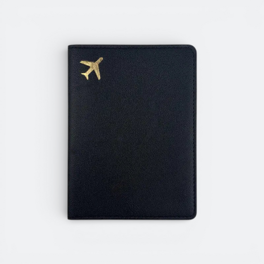 AïtaVia black passport holder with a gold airplane emblem, ideal for travel.