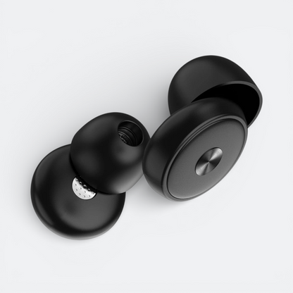 AïtaVia black silicone earplugs for comfortable travel, offering optimal sound isolation.