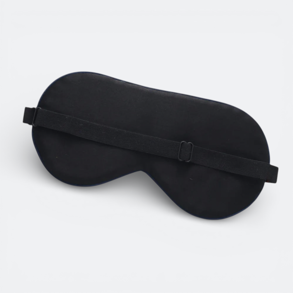 AïtaVia black silk sleep mask with adjustable elastic strap for travel and comfortable sleep.