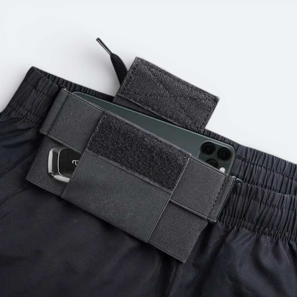 AïtaVia black travel belt with phone pouch and key holder, discreet and secure for travel.