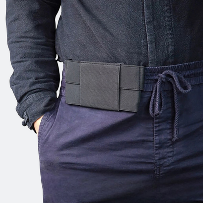 AïtaVia black secure travel waist pouch, discreet anti-theft design for passport and cash.