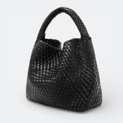 AïtaVia black woven leather large tote bag with a single handle. Ideal for travel and everyday use.