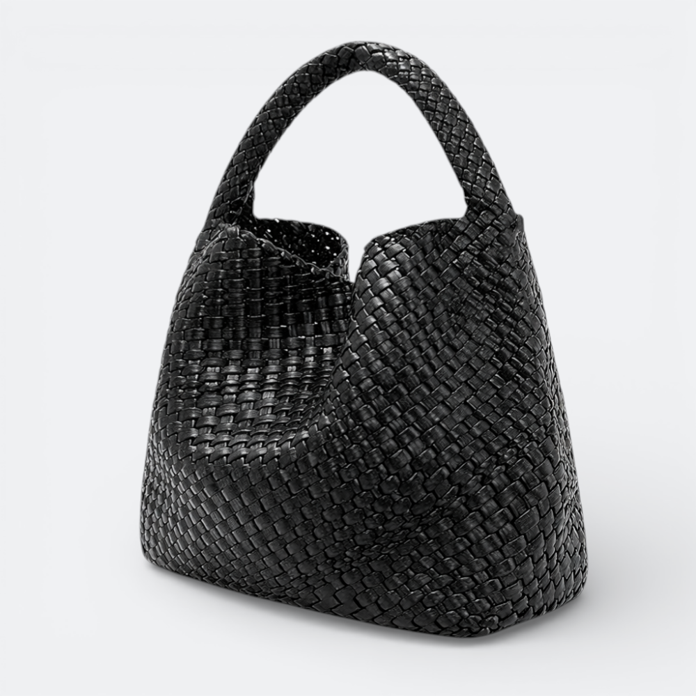 AïtaVia black woven leather large tote bag with braided handle. Spacious and elegant for travel.