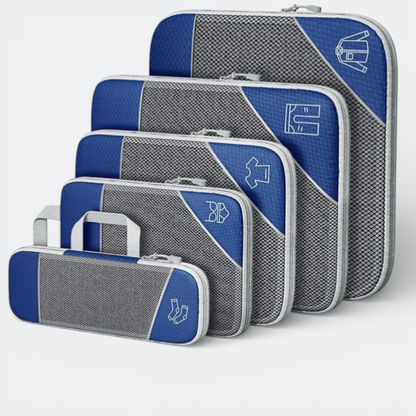 AïtaVia blue and grey compressible packing cubes with mesh fronts and zipper closures. Set of 5, various sizes, with clothing icons.