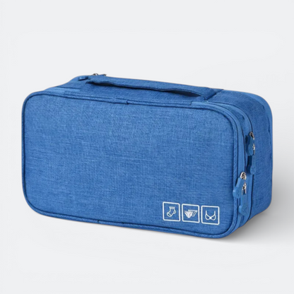 AïtaVia blue travel underwear organizer bag with zipper closure and icons for socks, underwear, and bras.