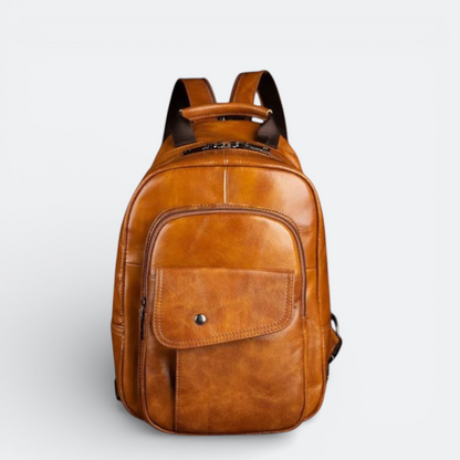 AïtaVia brown genuine leather backpack for men with a front flap pocket and zippered compartments.