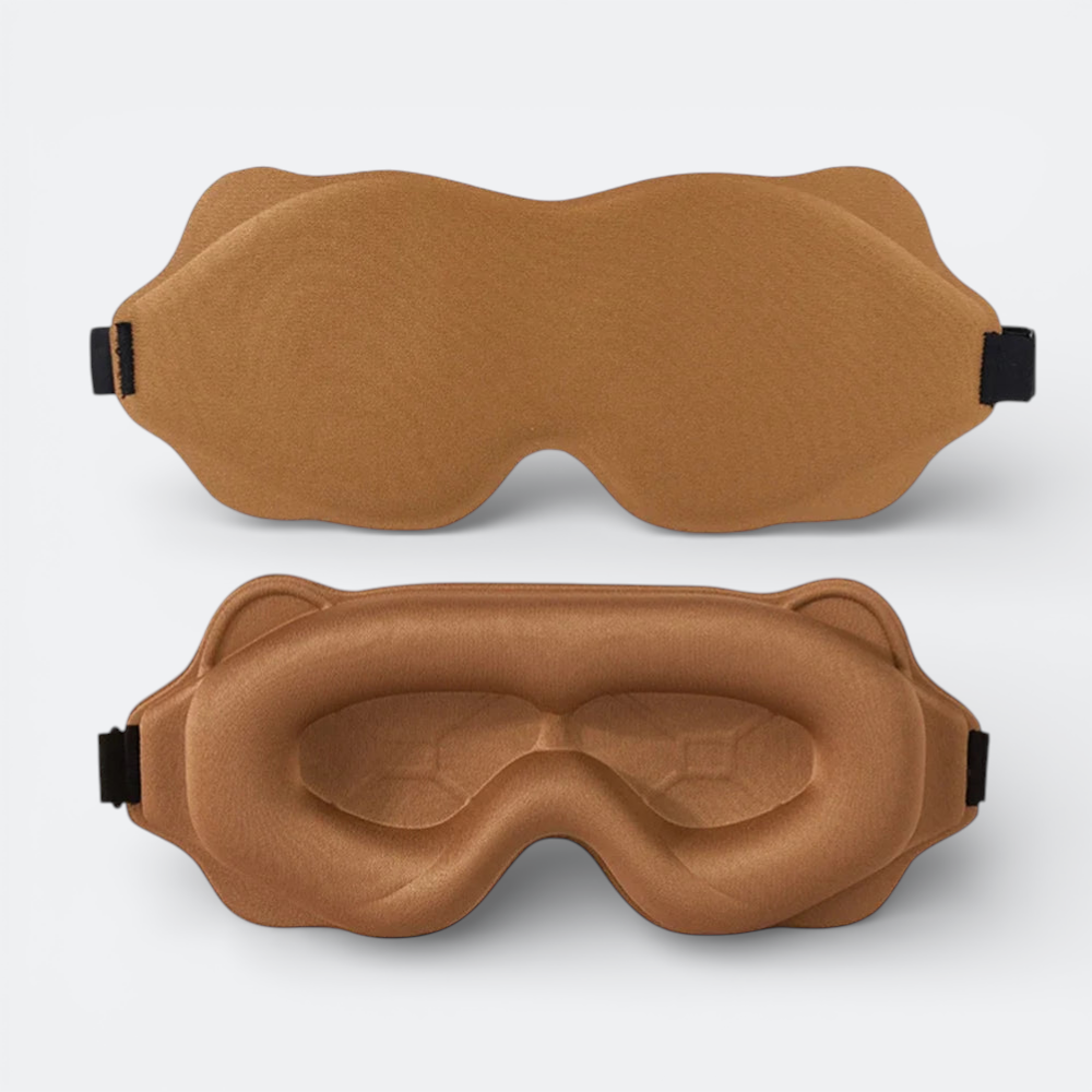 AïtaVia padded sleep mask in brown, designed for travel comfort with contoured eye cups and adjustable strap.