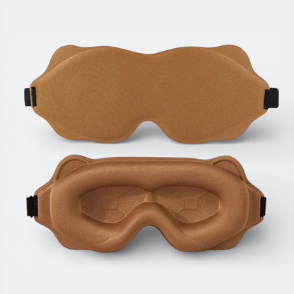 AïtaVia padded sleep mask in brown, designed for travel comfort with contoured eye cups and adjustable strap.