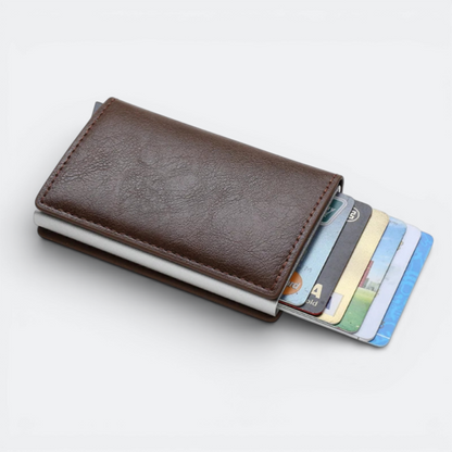 AïtaVia brown faux leather RFID blocking card holder with a silver metal frame and multiple cards visible.