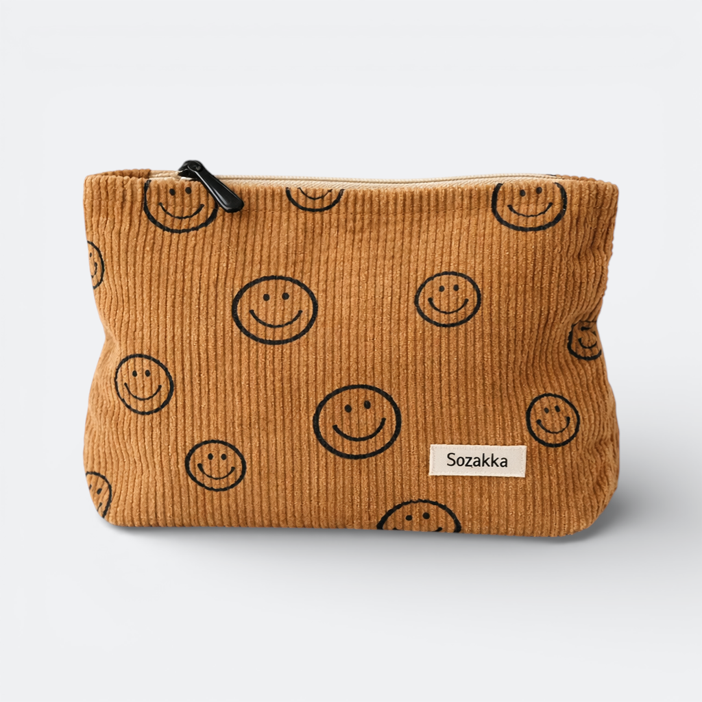 AïtaVia brown corduroy travel pouch with all-over smiley face print and black zipper.