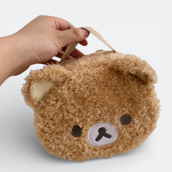 AïtaVia brown fluffy teddy bear face toiletry bag with embroidered features and a fabric loop handle.