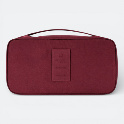 AïtaVia burgundy travel underwear organizer bag with handle and leather patch detail.