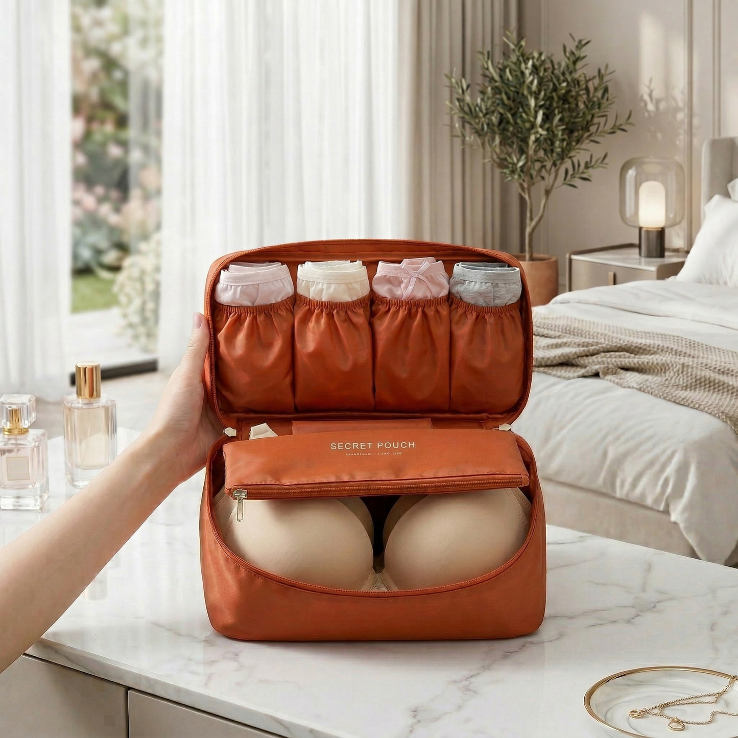 AïtaVia travel underwear organizer in burnt orange, with multiple compartments for socks and bras.