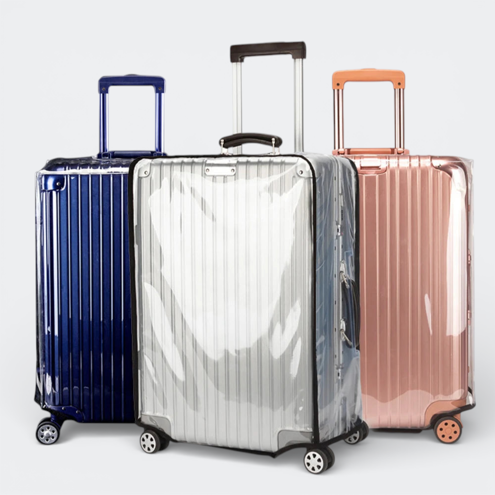 AïtaVia clear protective luggage covers on silver, blue, and rose gold suitcases.