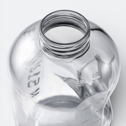 AïtaVia clear plastic water bottle with measurement markings and a wide mouth for easy filling and cleaning.