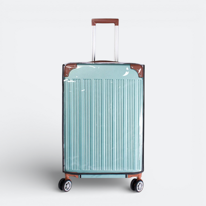 AïtaVia clear protective luggage cover over a teal suitcase with brown trim and wheels.