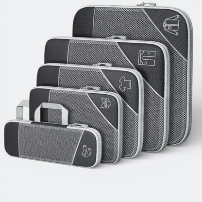 AïtaVia set of 5 grey compressible packing cubes with mesh fronts and zipper closures, featuring clothing icons.