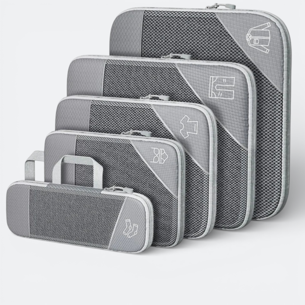 AïtaVia grey compressible packing cubes set with mesh fronts and clothing icons. Includes a small pouch for socks.