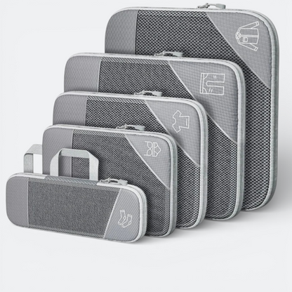 AïtaVia grey compressible packing cubes set with mesh fronts and clothing icons. Includes a small pouch for socks.