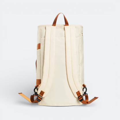 AïtaVia convertible backpack in cream with brown accents, featuring adjustable shoulder straps and a top handle.