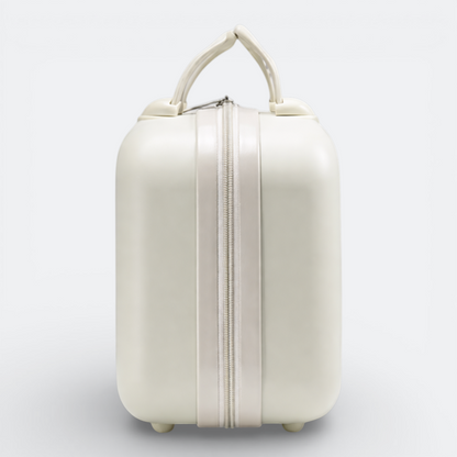 AïtaVia pale cream hard-shell cosmetic case with a central zipper and top handle. Ideal for travel and makeup organization.