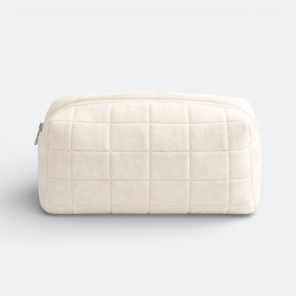 AïtaVia cream plush quilted makeup bag with zipper closure. Soft and practical for travel.
