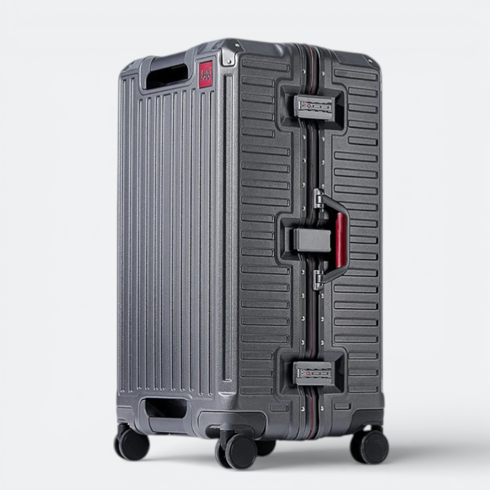AïtaVia dark grey aluminium suitcase with red accents and TSA locks. Features a ribbed texture and sturdy frame.