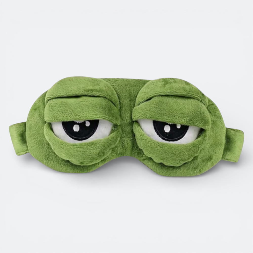 AïtaVia green plush frog-eye sleep mask with large, sleepy eyes. Soft material for travel comfort.