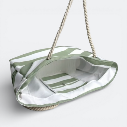 AïtaVia green and white striped canvas beach tote bag with rope handles and interior pockets.