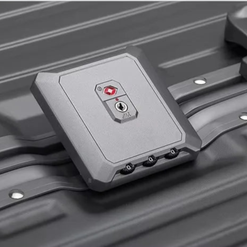 AïtaVia grey hard-shell suitcase with TSA lock and combination wheels. Durable and spacious for travel.