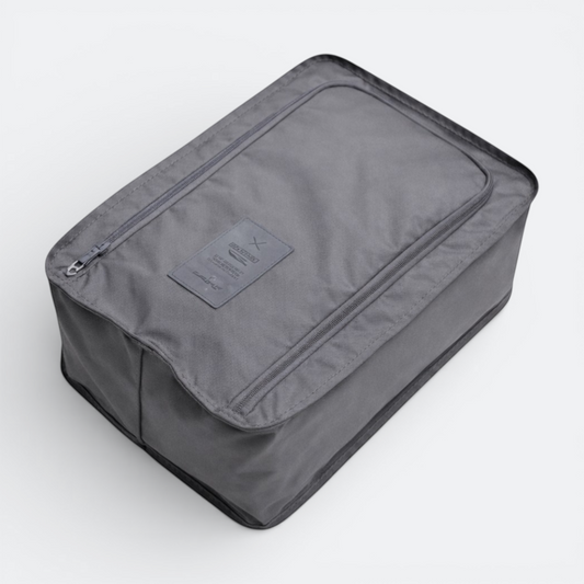 AïtaVia grey nylon travel shoe bag with zippered closure and a small fabric label.