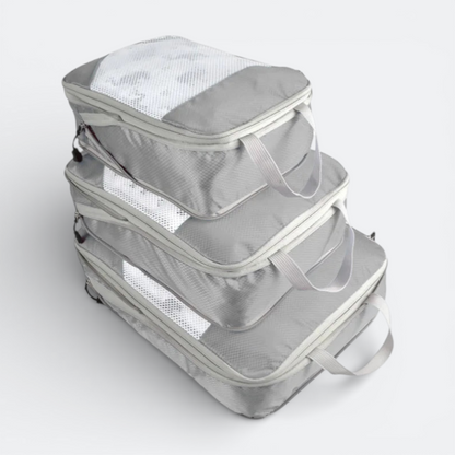 AïtaVia grey packing cubes set of 3 with mesh tops and handles for cabin luggage organization.