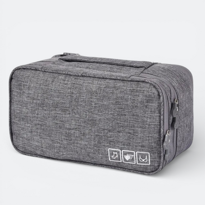 AïtaVia grey heathered fabric travel underwear organizer bag with zipper closure and interior compartments.