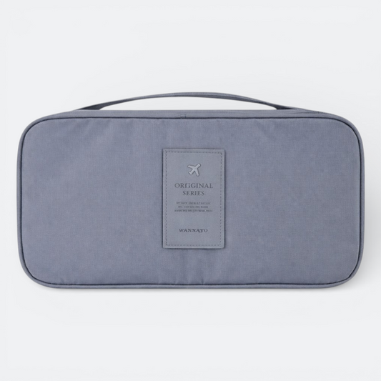AïtaVia grey travel underwear organizer bag with a top handle and a grey patch with airplane logo and text.