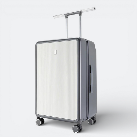 AïtaVia grey and white ribbed suitcase with a large telescopic handle and spinner wheels.