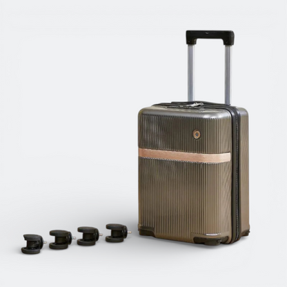AïtaVia grey ribbed suitcase with removable wheels and rose gold accent band.