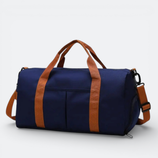 AïtaVia navy blue duffel bag with tan straps and accents, featuring two front pockets and a detachable shoulder strap.