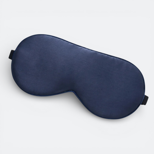 AïtaVia navy blue silk sleep mask with elastic strap for travel and comfortable sleep.