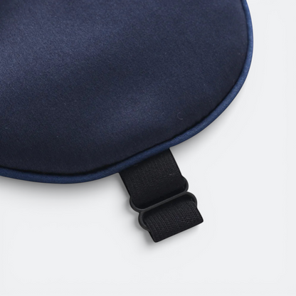 AïtaVia navy blue silk sleep mask with adjustable strap for travel and comfortable sleep.